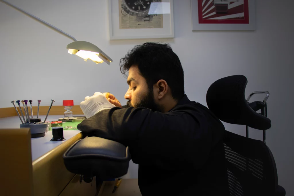 Watch technician working on a watch in TP Labs watch servicing Centre